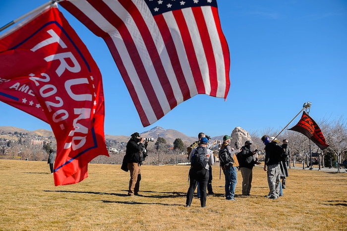 1(Trent Nelson | The Salt Lake Tribune) Journalists outnumber a pair of Trump supporters at the state Capitol in Salt Lake City on Sunday, Jan. 17, 2021.