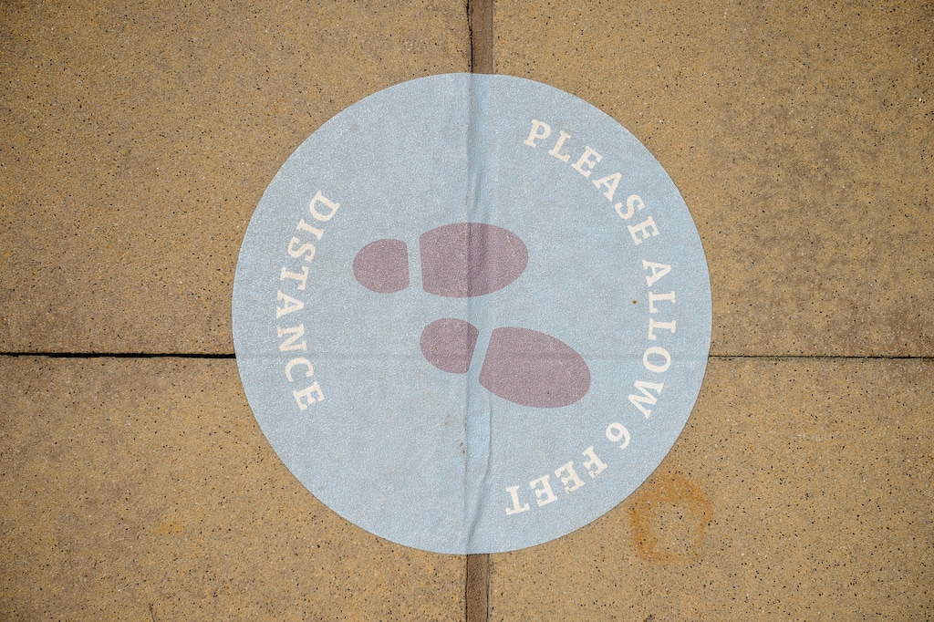 (Trent Nelson | The Salt Lake Tribune) A social distancing message on the sidewalk at Station Park in Farmington as Davis County had its highest single-day increase in coronavirus cases on Friday, July 10, 2020.