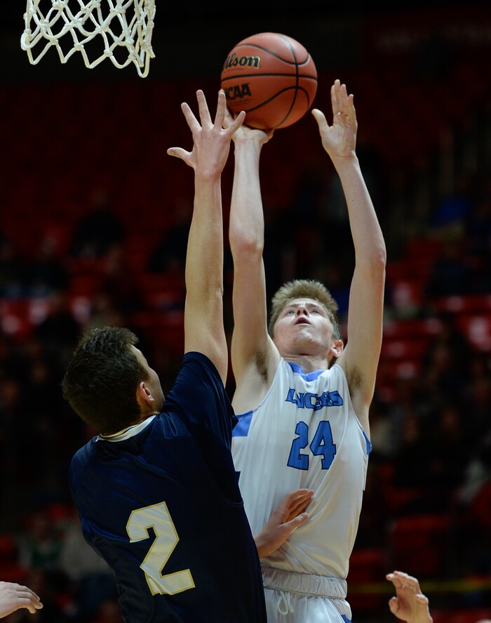 (Francisco Kjolseth  |  The Salt Lake Tribune)  Westlake vs Layton, 6A State high school basketball tournament at the Huntsman Center in Salt Lake City, Thursday March 1, 2018. Chase Potter (24) goes over Tredyn Christensen (2). 