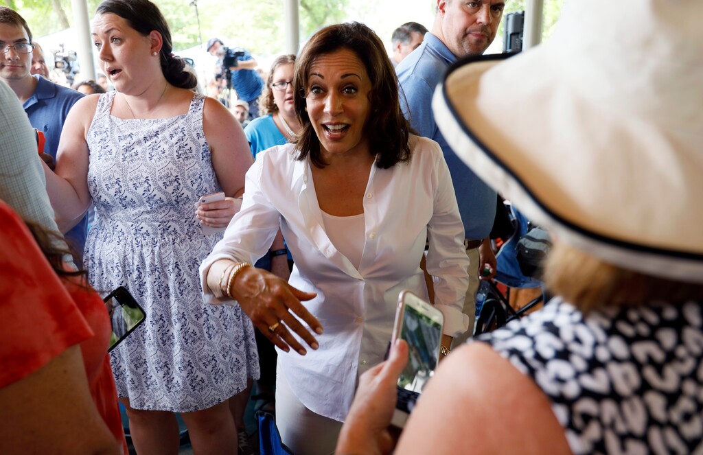 (Charlie Neibergall) Democratic presidential candidate Sen. Kamala Harris greets local residents during the West Des Moines Democrats' annual picnic, Wednesday, July 3, 2019, in West Des Moines, Iowa.