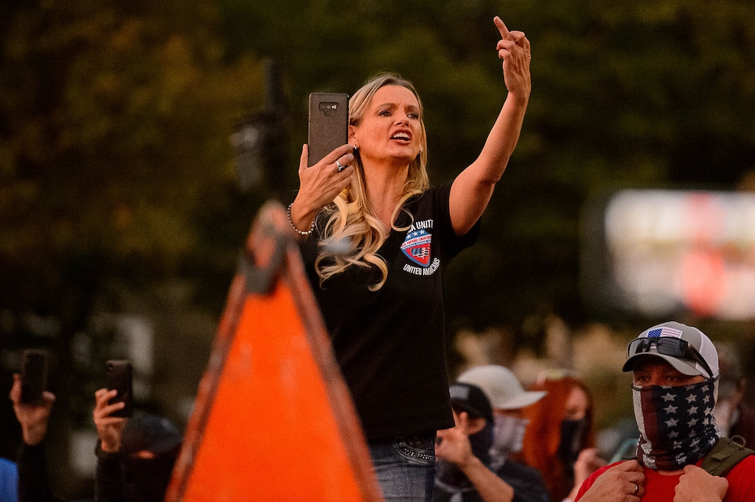 (Trent Nelson  |  The Salt Lake Tribune) A woman taunts protesters near Kingsbury Hall in Salt Lake City on Wednesday, Oct. 7, 2020.