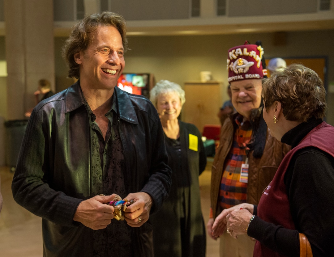 (Rick Egan  |  The Salt Lake Tribune)    Kurt Bestor visits with fans after performing an intimate one-man show at Shriners' Hospital, Tuesday, Nov. 19, 2019.