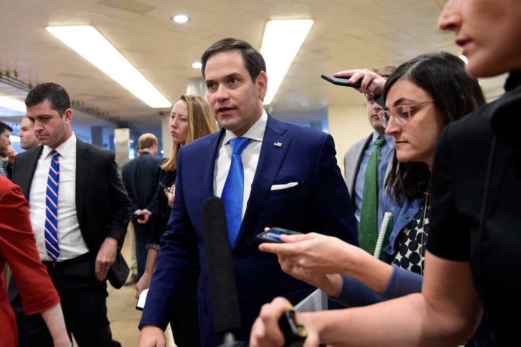In this Nov. 29, 2018, file photo, Sen. Marco Rubio, R-Fla., center, is followed by reporters on Capitol Hill in Washington. (AP Photo/Susan Walsh, File)