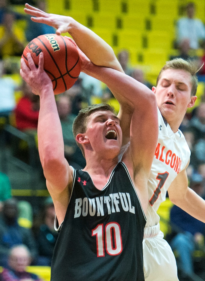 (Rick Egan  |  The Salt Lake Tribune)   Bountiful Braves Brig Willard (10) shoots as Skyridge Falcons Mckay Kimbal (10) defends, in 5A basketball playoff action between the Bountiful Braves and Skyridge Falcons, at the UCCU Center in Orem, Monday, Feb. 26, 2018.