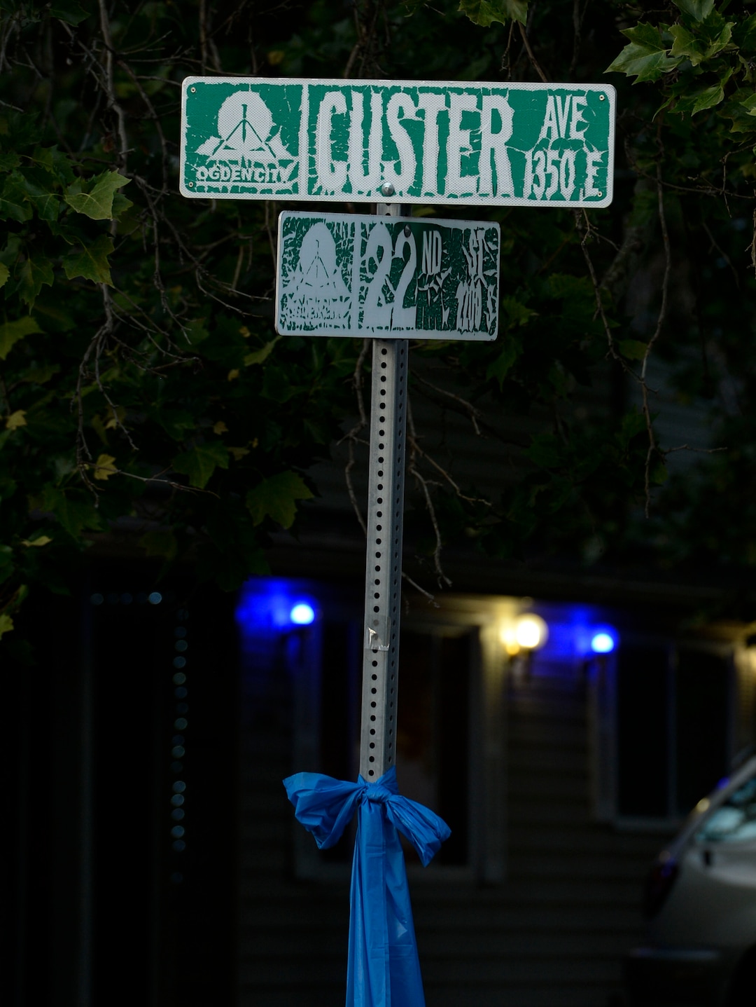 (Leah Hogsten  |  The Salt Lake Tribune) Ogden Police Department vehicles drive past Officer Nate Lyday's childhood home on Custer Avenue in Ogden in a Memorial Procession and Community Vigil in honor of Lyday's life. The procession made its way through five other Ogden landmarks before ending at Lindquist Field.