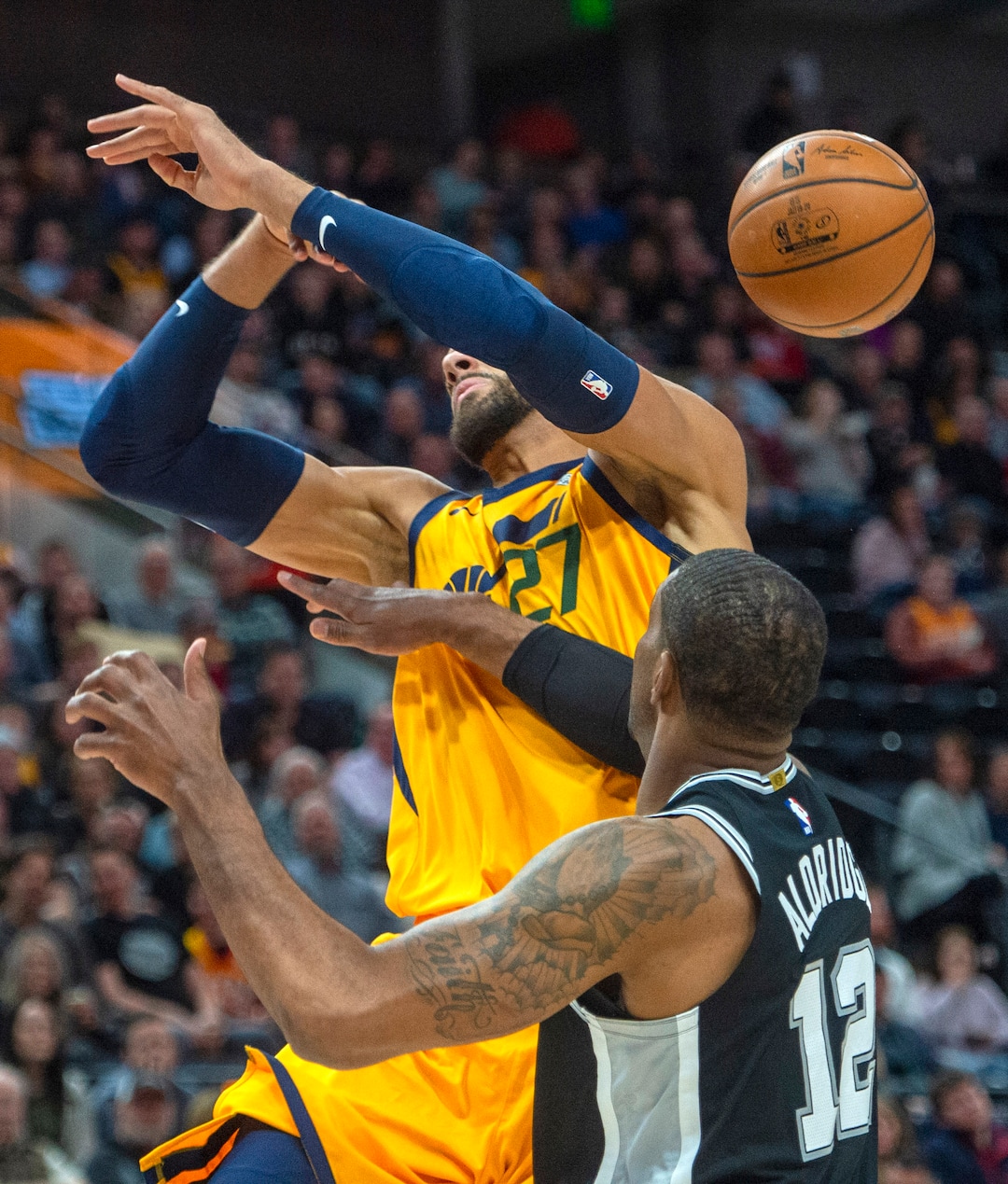 (Rick Egan  |  The Salt Lake Tribune)    Utah Jazz center Rudy Gobert (27) is fouled by San Antonio Spurs forward LaMarcus Aldridge (12), in NBA action between the Utah Jazz and the San Antonio Spurs, in Salt Lake City, Friday, Feb. 21, 2020.
