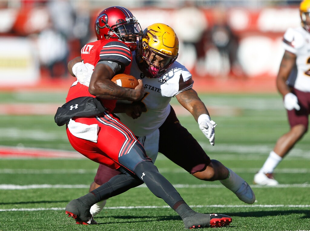Arizona State linebacker DJ Calhoun, right, sacks Utah quarterback Tyler Huntley, left, in the second half of an NCAA college football game, Saturday, Oct. 21, 2017, in Salt Lake City. (AP Photo/Rick Bowmer)