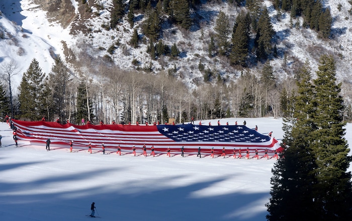 (Al Hartmann  |  The Salt Lake Tribune) 	Sundance Mountain Resort partnered with Follow the Flag to ski a giant American Flag down Bearclaw run. The flag is 78' x 150' and weighs more than 400 pounds, the largest free-flying American flag in the world. It took coordination of 50 of Sundance's best skiers to pull it off.  This event is to express patriotism and support of Team USA and athletes representing the country in the upcoming Winter Olympics in Pyeongchang, South Korea. 
