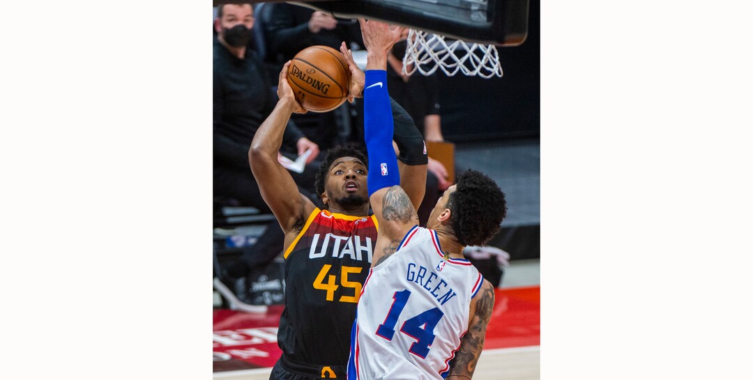 (Rick Egan | The Salt Lake Tribune)  Utah Jazz guard Donovan Mitchell (45) shoots over Philadelphia 76ers forward Danny Green (14), in NBA action between the Utah Jazz and the Philadelphia 76ers at Vivint Arena, on Monday, Feb. 15, 2021.