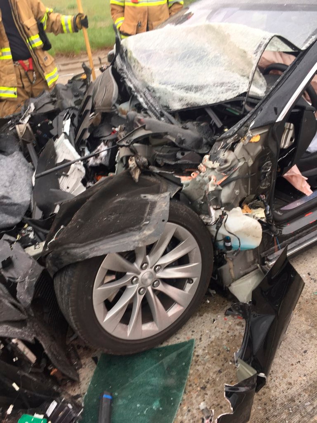 In this Friday, May 11, 2018, photo released by the South Jordan Police Department shows a traffic collision involving a Tesla Model S sedan with a Fire Department mechanic truck stopped at a red light in South Jordan, Utah. Witnesses indicated the Tesla Model S did not brake prior to impact. Police Sgt. Samuel Winkler said the car's air bags were activated and that the Tesla's 28-year-old driver suffered a broken right ankle, while the driver of the mechanic truck didn't require treatment. Police in a Salt Lake City suburb say it's not immediately known whether a Tesla Model S sedan's semi-autonomous Autopilot driving system was in use when it rear-ended a truck apparently without braking before impact at approximately 60 mph. (South Jordan Police Department via AP)