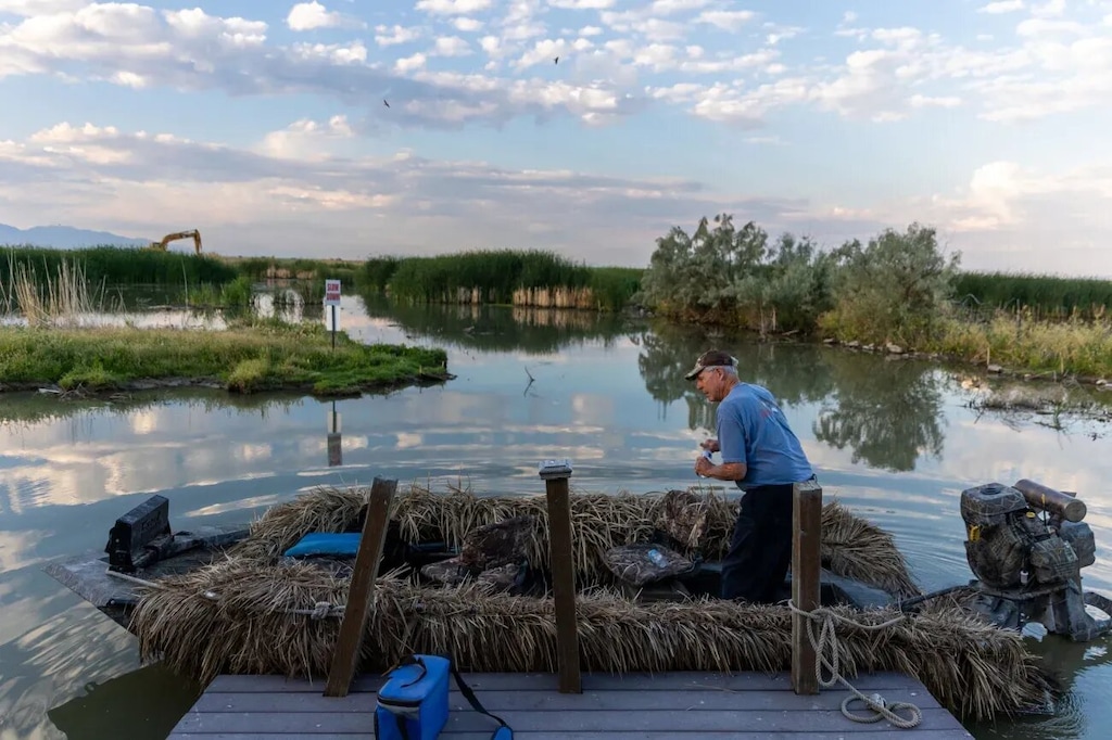 (Ben B. Baun | Deseret News) Carroll Dolson, a member of the Chesapeake Duck Club near Corinne, Box Elder County, prepares his boat club on Wednesday, July 13, 2022.