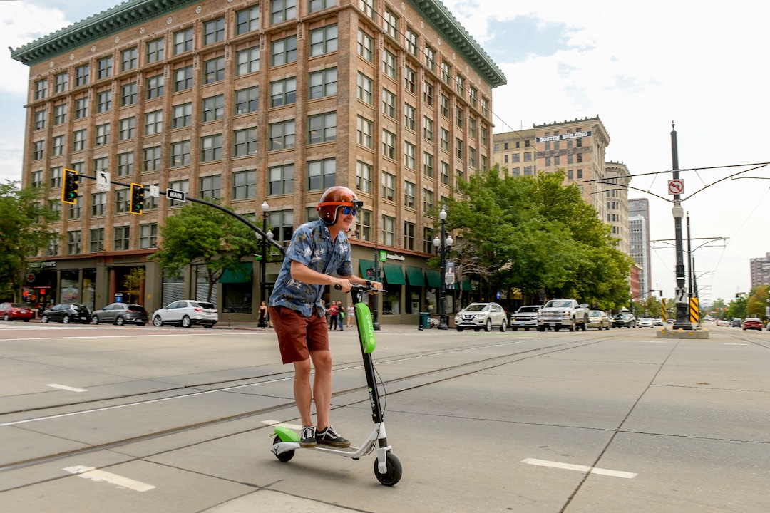 Leah Hogsten  |  The Salt Lake Tribune  Salt Lake Tribune columnist Robert Gehrke rides a Lime dockless e-scooter from the Salt Lake City Library to The Salt Lake Tribune building, Thursday, August 2, 2018.  · 