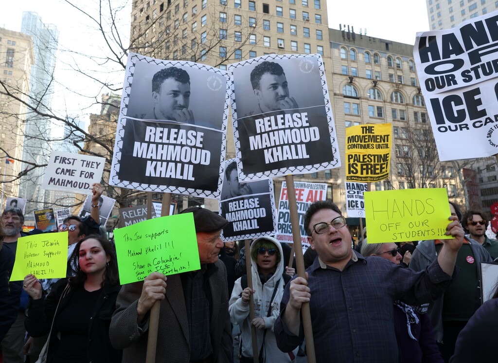 People gather to protest the arrest of Mahmoud Khalil, a well-known activist who played a major role in Columbia University's pro-Palestinian student movement last year, outside the Jacob Javitz Federal Building in Manhattan, on Monday, March 10, 2025. (Caitlin Ochs/The New York Times)