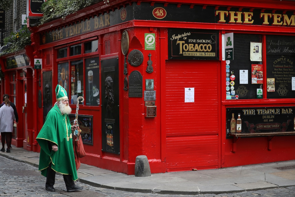 (Peter Morrison | AP) A man dressed as St Patrick walks past a closed bar in Dublin in 2020. A new book examines what it's like to be a Latter-day Saint in Ireland.