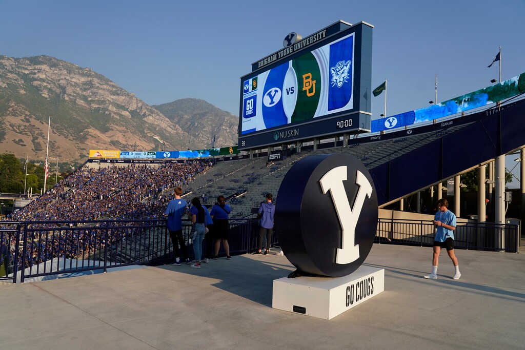 (George Frey | AP) BYU fans enter LaVell Edwards Stadium before an NCAA college football game against Baylor, Saturday, Sept. 10, 2022, in Provo.