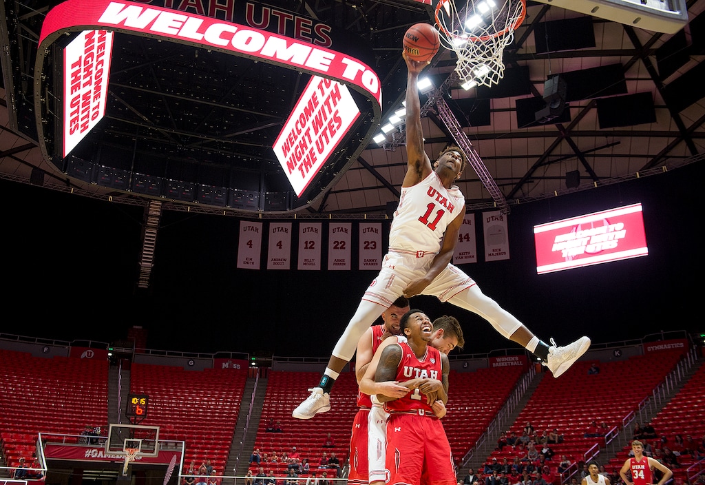 (Leah Hogsten  |  The Salt Lake Tribune) Utah Utes guard Beau Rydalch (20), guard Brooks King (14) and guard Justin Bibbins (1) laugh as forward Chris Seeley (11) hops over the three of them to dunk the ball during the Utah men's and women's basketball teams, Night with the Utes, Tuesday, Oct. 17, at the Jon M. Huntsman Center. 