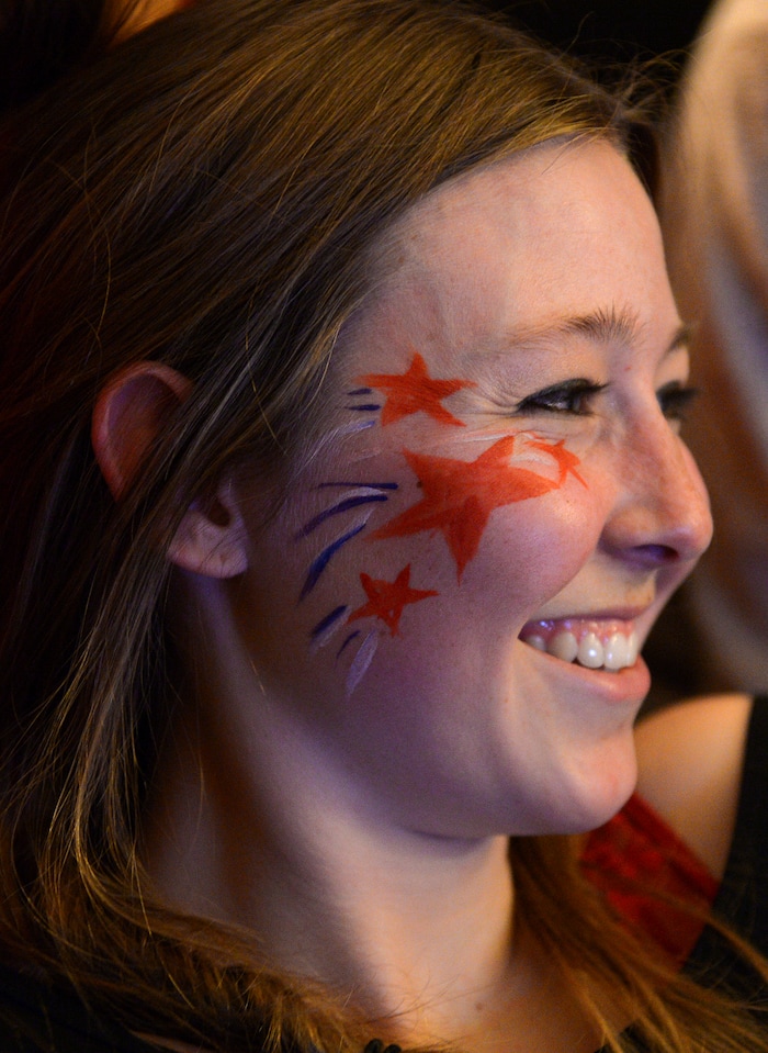(Leah Hogsten | The Salt Lake Tribune) Scout Invie painted her face in support of her friend first-time Olympian Darian Stevens. Westminster students and friends of first-time Olympian Darian Stevens gathered for a watch party in Sugar House to cheer on Stevens as she competes in her first qualifying ski slopestyle competition run Friday, Feb. 16, 2018 during the 2018 Pyeongchang Winter Olympics. Stevens is a graduate of the Park City Winter Sports School and a business major at Westminster.