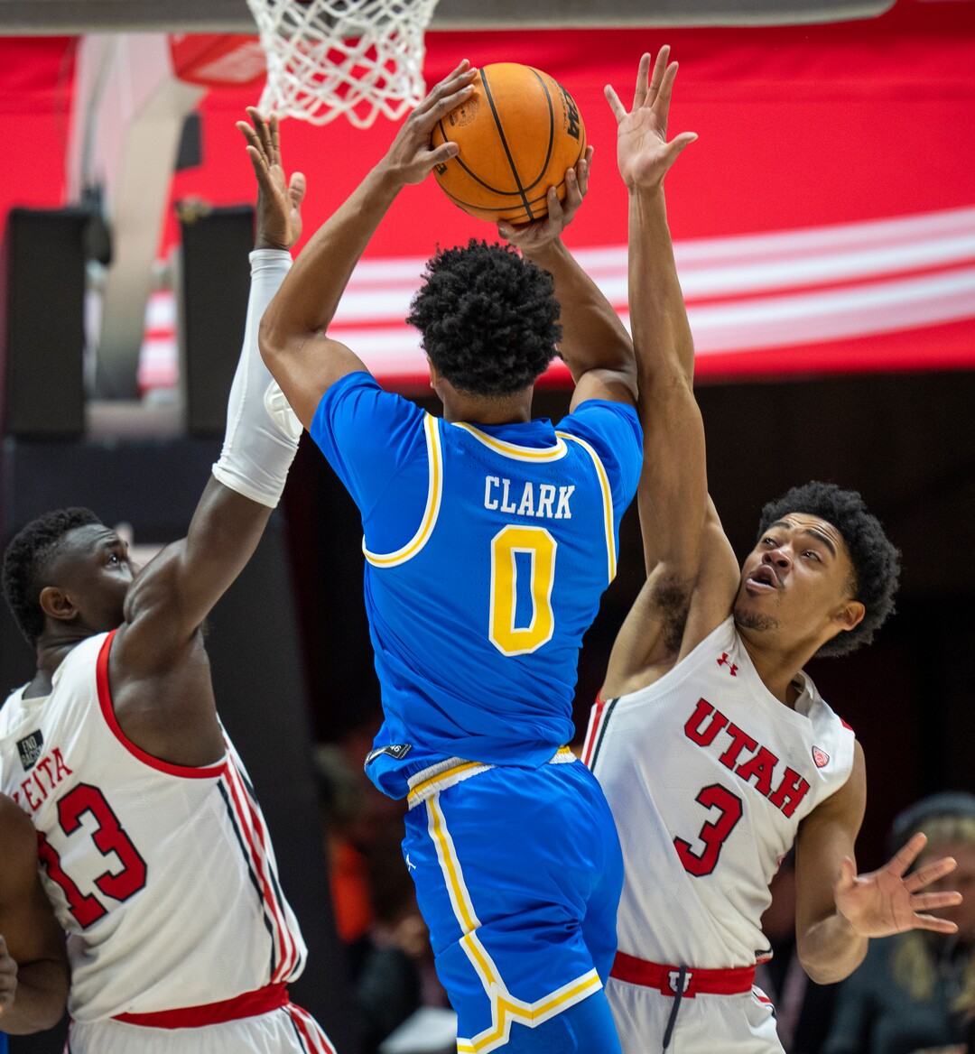 (Rick Egan | The Salt Lake Tribune) Utah Utes center Keba Keita (13) and Utah Utes forward Bostyn Holt (3) guard UCLA Bruins guard Jaylen Clark (0), in PAC-12 basketball action between Utah Utes and UCLA Bruins, at the Jon M. Huntsman Center, Thursday, February. 23, 2022.