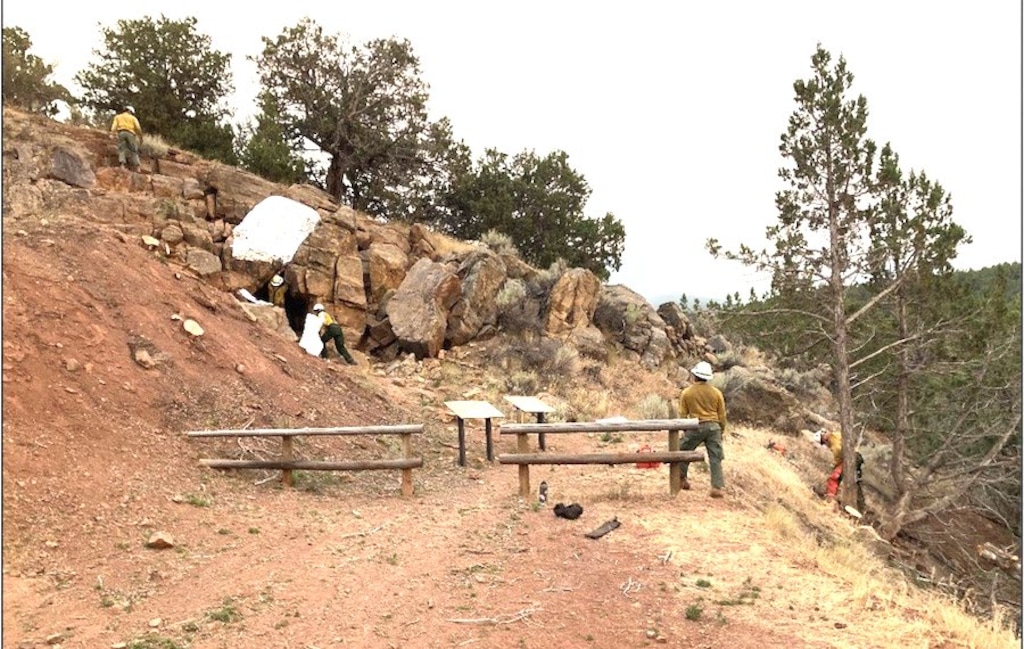 (Utah Fire Info) Firefighters work to protect the Chalk Creek Hieroglyphs.