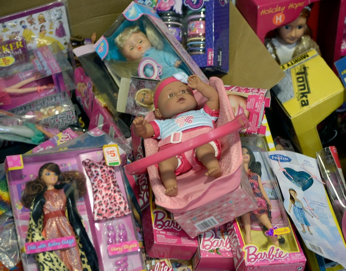 (Al Hartmann  |  The Salt Lake Tribune) 	Dolls of every kind at the Salvation Army's Angel Tree distribution warehouse at the Utah State Fairgrounds.   Needy families living in the Salt Lake School District picked up their bags of presents Friday Dec. 22, just in time for Christmas. 