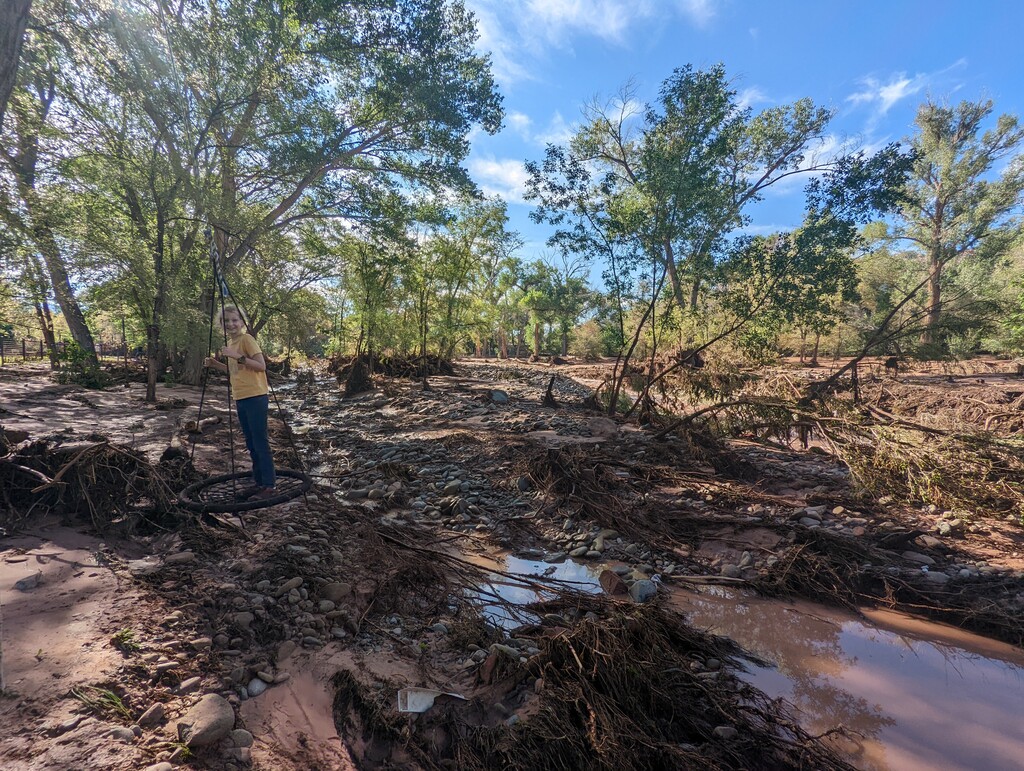 (Randall Lewis)

A child swings next to Mill Creek in Moab on Sunday, Aug. 20, 2022, a day after the 100-year flood. A river gauge on the west side of Moab showed the river was 10 feet higher than its average of about 4.5 feet at that gauge.