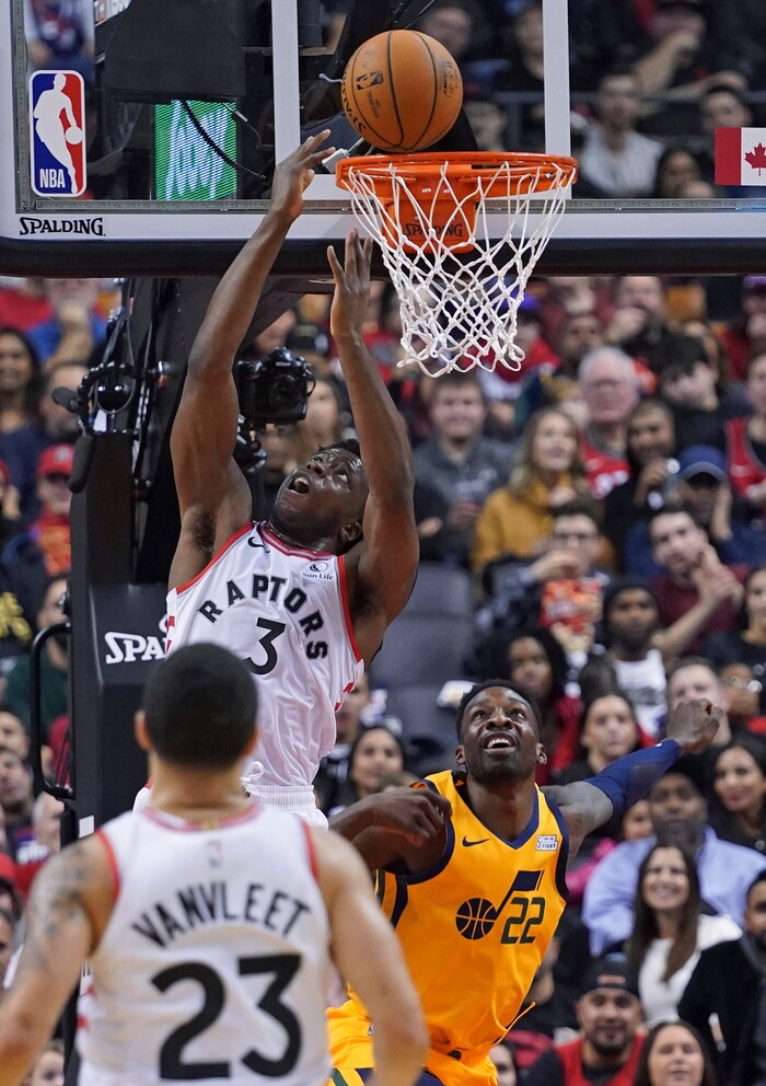 Toronto Raptors OG Anunoby (3) goes to the basket as Utah Jazz's Jeff Green (22) defends during first half NBA basketball action in Toronto, Sunday, Dec. 1, 2019. (Hans Deryk/The Canadian Press via AP)