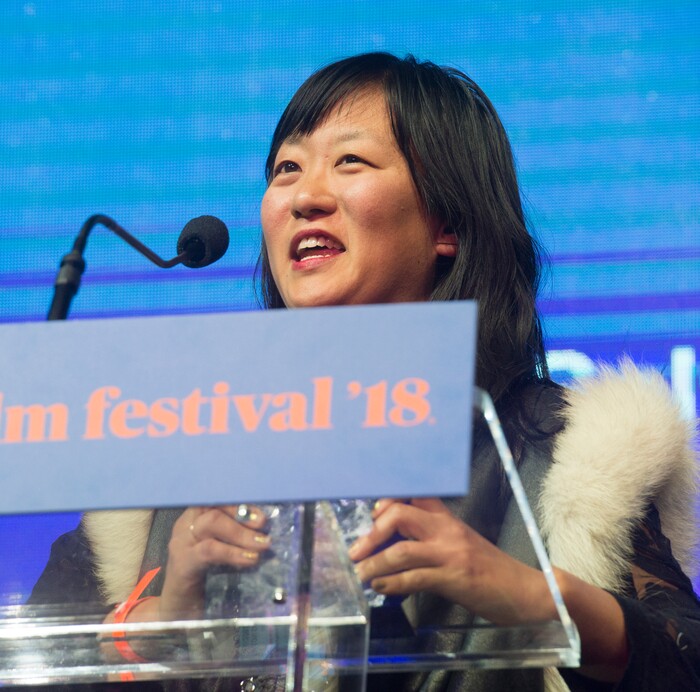 (Rick Egan  |  The Salt Lake Tribune)     Writer Christina Choe accepts the U.S. Dramatic Waldo Salt Screenwriting Award for the film Nancy, at the 2018 Sundance Film Festival Awards Night, Saturday, January 27, 2018.


