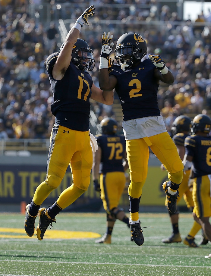 California safety Luke Rubenzer (17) celebrates with cornerback Darius Allensworth (2) after recovering a fumble against Weber State during the second half of an NCAA college football game in Berkeley, Calif., Saturday, Sept. 9, 2017. (AP Photo/Jeff Chiu)