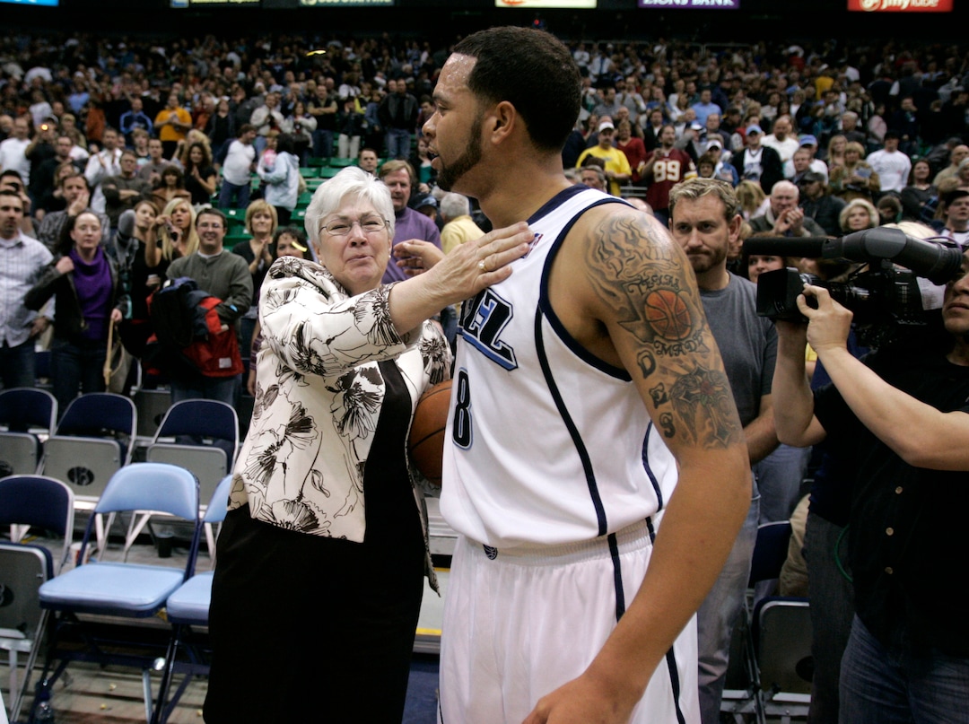 (Jim Urquhart  |  Tribune file photo) Utah Jazz guard Deron Williams (8) presents Gail Miller with the ball after their game against New Orleans Saturday, February 21, 2009 at EnergySolutions Arena in Salt Lake City.  Gail's husband Larry H. Miller passed away the day before from complications from Type 2 Diabetes. The Jazz defeated the Hornets 102 to 88.