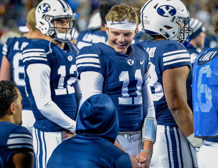 Leah Hogsten | The Salt Lake Tribune Brigham Young Cougars starting quarterback Zach Wilson (11) celebrates with his teammates as Brigham Young University hosts Hawaii at Lavell Edwards Stadium in Provo, Saturday Oct. 13, 2018. BYU defeated Hawaii 49-23.