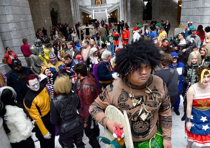(Scott Sommerdorf | The Salt Lake Tribune) A man dressed as Maui from the movie "Moana" mounts the steps in the Utah Capitol Rotunda during a FanX Salt Lake Comic Convention news conference on Wednesday, April 11, 2018.
