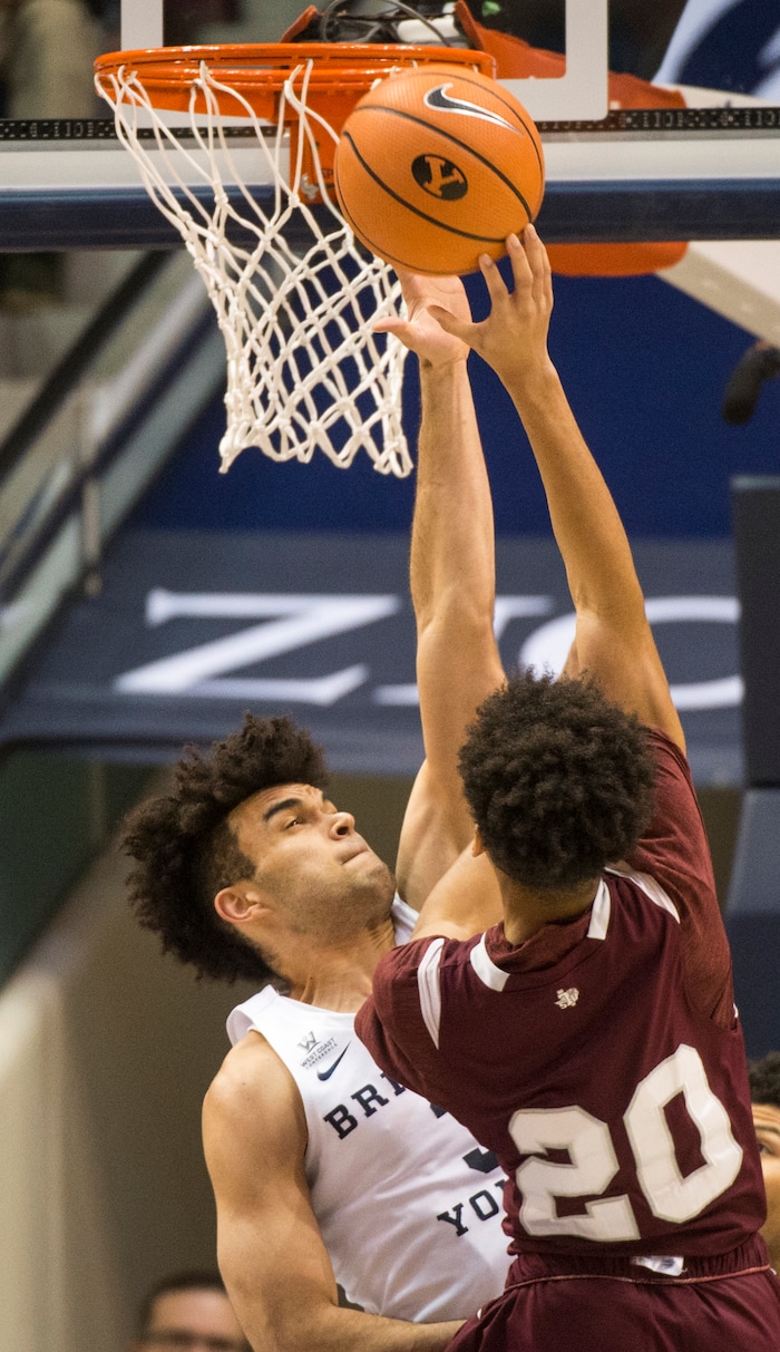 (Rick Egan  |  The Salt Lake Tribune)   Brigham Young Cougars guard Elijah Bryant (3) blocks a shot by Texas Southern Tigers guard Cainan McClelland (20), in basketball action, Brigham Young Cougars vs Texas Southern Tigers, at the Marriott Center in Provo, Saturday, December 23, 2017.