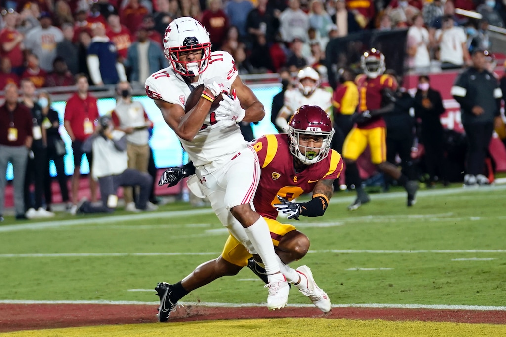 Utah wide receiver Devaughn Vele, left, makes a touchdown catch past Southern California cornerback Chris Steele (8) during the first half of an NCAA college football game Saturday, Oct. 9, 2021, in Los Angeles. (AP Photo/Marcio Jose Sanchez)