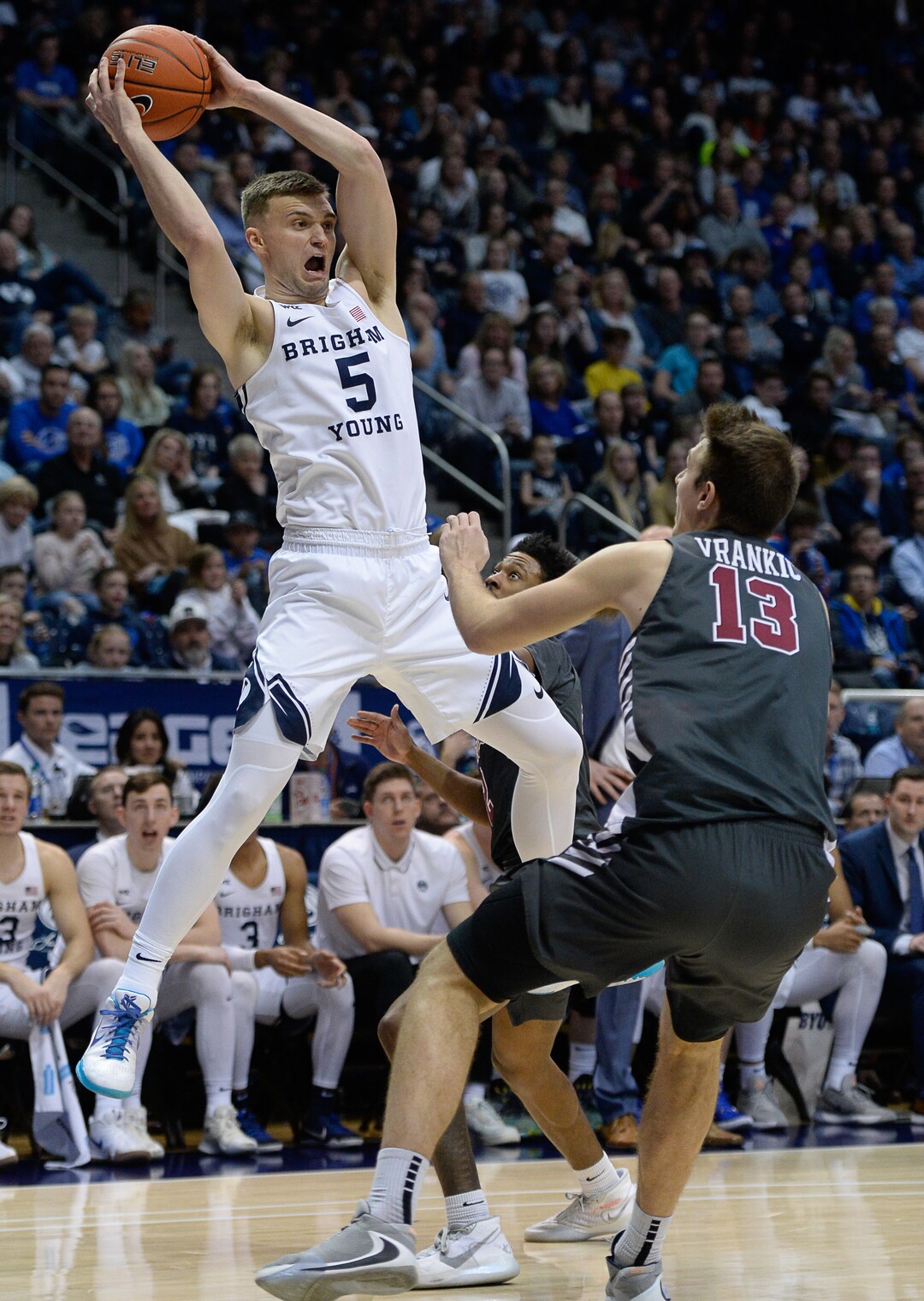 (Francisco Kjolseth  |  The Salt Lake Tribune) Brigham Young Cougars guard Jake Toolson (5) pulls down a high pass over Santa Clara Broncos forward Josip Vrankic (13) in the second half as the Brigham Young Cougars host the Santa Clara Broncos at the Marriott Center in Provo, Thursday, Feb. 20, 2020. BYU won 85-75.
