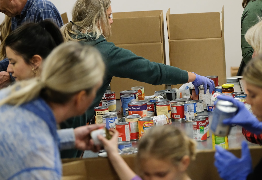 (Francisco Kjolseth  |  The Salt Lake Tribune) The community comes together during the coronavirus outbreak on Saturday, March 14, 2020, after hearing the Utah Food Bank is hurting for volunteers, since groups that normally volunteer canceled after the order of mass gatherings.