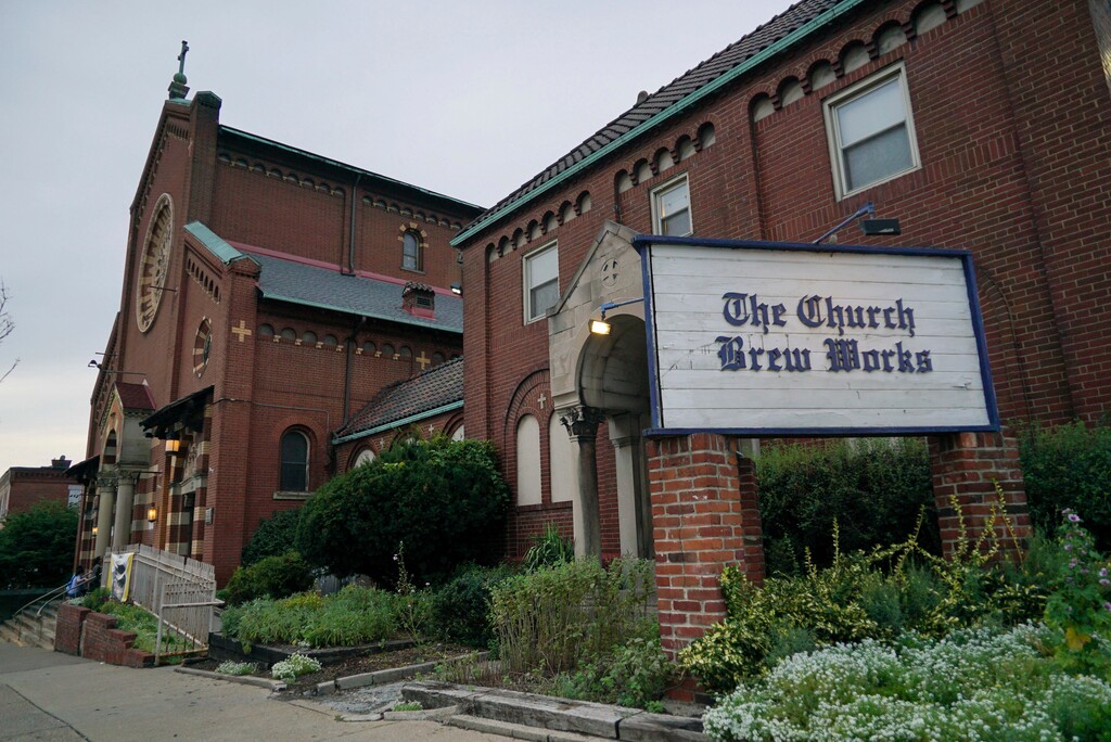 (AP Photo/Dake Kang) In this Aug. 7, 2017 photo, the Church Brew Works, a brewery operating in a renovated church, stands in Pittsburgh. At the Church Brew Works, an early church-turned-brewery that opened in 1996, patrons slide into booths crafted from pews. Breweries opening in renovated churches are winning fans but earning disapproval from clergy and worshippers across the U.S.