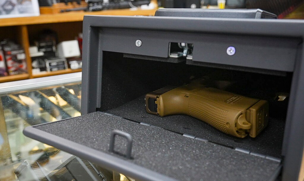 (Bethany Baker  |  The Salt Lake Tribune) A handgun is seen inside a gun vault at the gun shop Gunnies in Orem on Wednesday, Sept. 18, 2024.