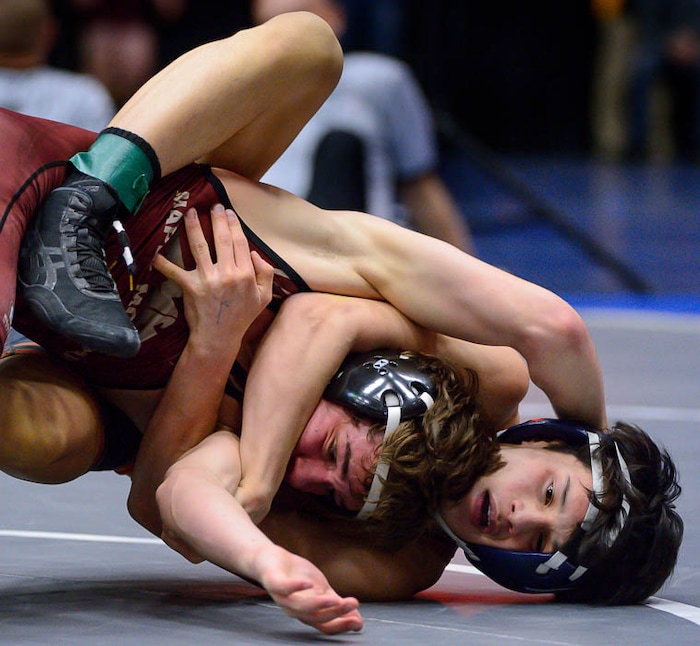 (Trent Nelson | The Salt Lake Tribune)  Brighton's Anthonee Ouk (right) and Maple Mountain's Cole Tierre Patterson, 5A State Championships, high school wrestling quarterfinals in Orem, Wednesday February 7, 2018.