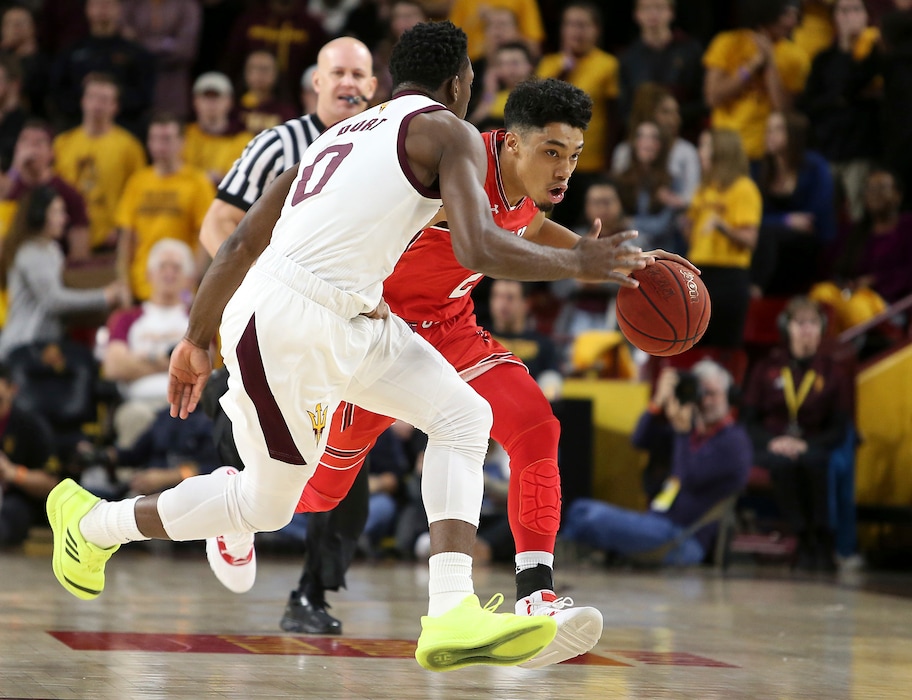 Utah guard Sedrick Barefield, right, advances the ball up court as Arizona State's Luguentz Dort (0) defends during the first half of an NCAA college basketball game, Thursday, Jan. 3, 2019, in Tempe, Ariz. (AP Photo/Ralph Freso)