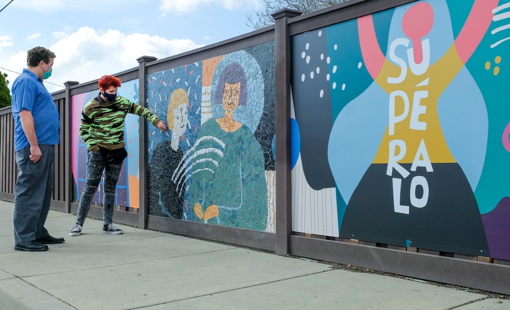 (Leah Hogsten | The Salt Lake Tribune) Utah muralist and mosaicist Roger Whiting and Herriman High School student Mati Simonds discuss the artwork of the new mural dedicated to mental health awareness located at 3091 South 2700 West in West Valley City, Mar. 16, 2021.