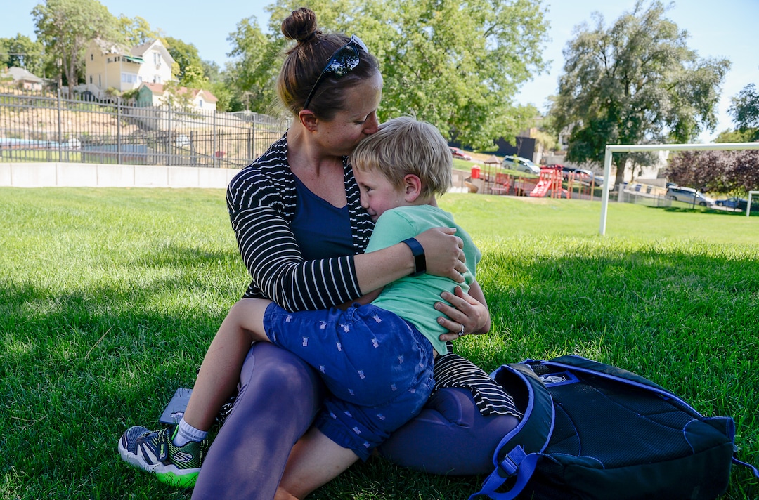 (Francisco Kjolseth  |  The Salt Lake Tribune)  Lana Medina gets a warm embrace from her son Dylan, 5, following his first day of kindergarten at Washington Elementary on Monday, Aug. 19, 2019.