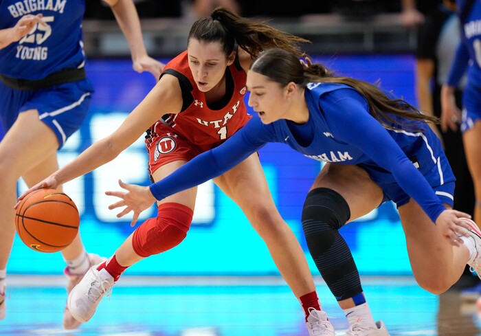 (Francisco Kjolseth | The Salt Lake Tribune) Utah Utes guard Isabel Palmer (1) and BYU Cougars guard Nani Falatea (3) chase down a ball in basketball action between the Utah Utes and the Brigham Young Cougars, at the Marriott Center in Provo, on Saturday, Dec. 10, 2022.