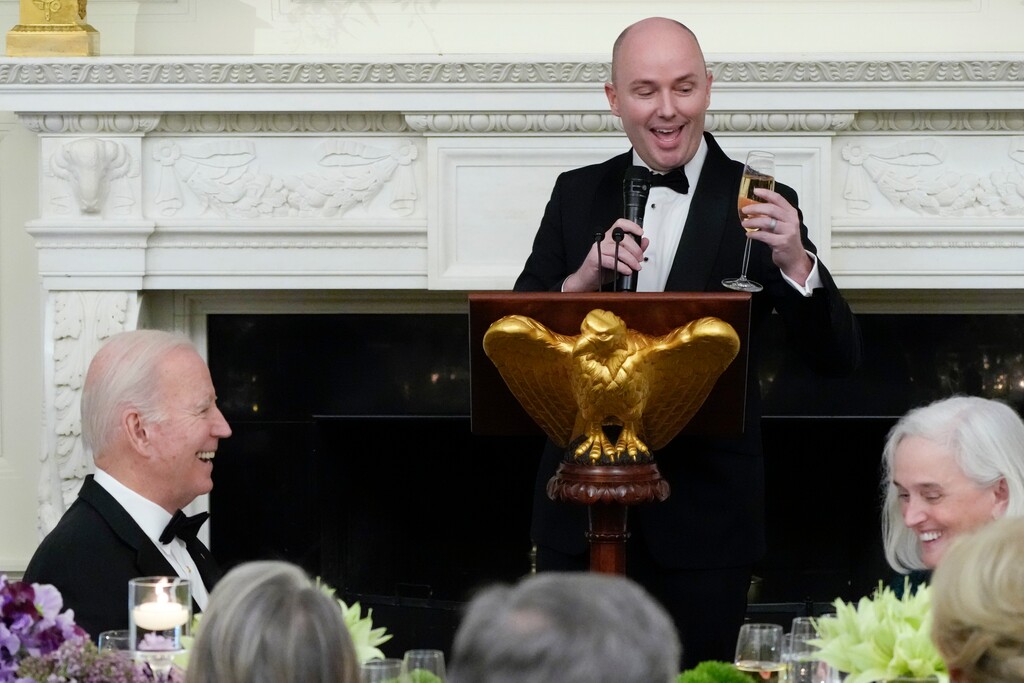 (Manuel Balce Ceneta | AP) President Joe Biden reacts as the National Governors Association Vice Chair Utah Gov. Spencer Cox speaks during a dinner reception for governors and their spouses in the State Dining Room of the White House, Saturday, Feb. 11, 2023, in Washington.