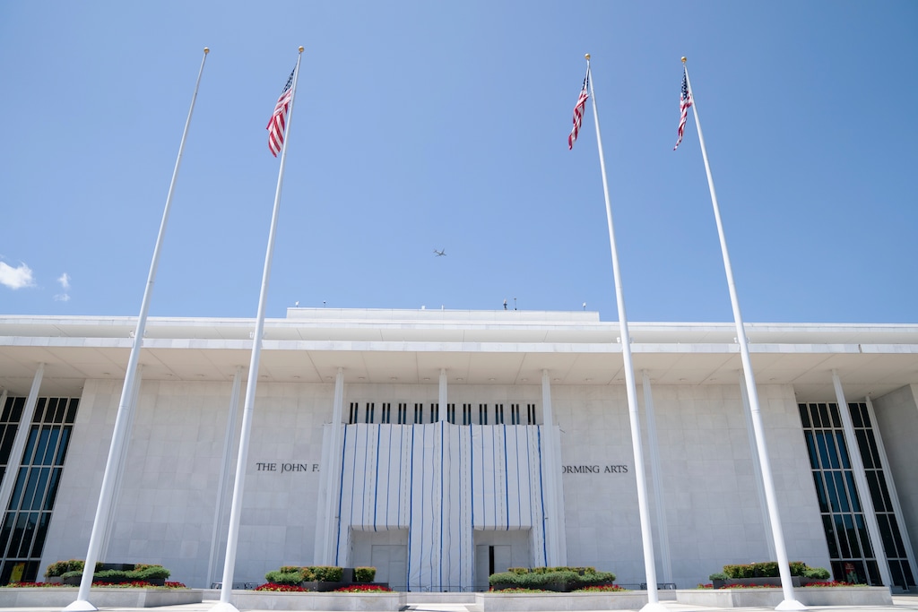 A tarp covers a portion of the front of the John F. Kennedy Center for the Performing Arts, Thursday, July 23, 2026, in Washington. (AP Photo/Allison Robbert)