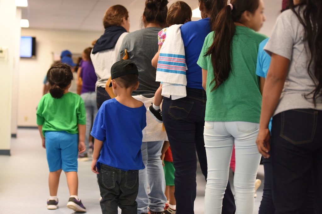 (Charles Reed | U.S. Immigration and Customs Enforcement | The Associated Press) In this Thursday, Aug. 9, 2018, photo, provided by U.S. Immigration and Customs Enforcement, mothers and their children stand in line at South Texas Family Residential Center in Dilley, Texas. Currently housing 1,520 mothers and their children, about 10 percent are families who were temporarily separated and then reunited under a “zero tolerance policy” that has since been reversed.