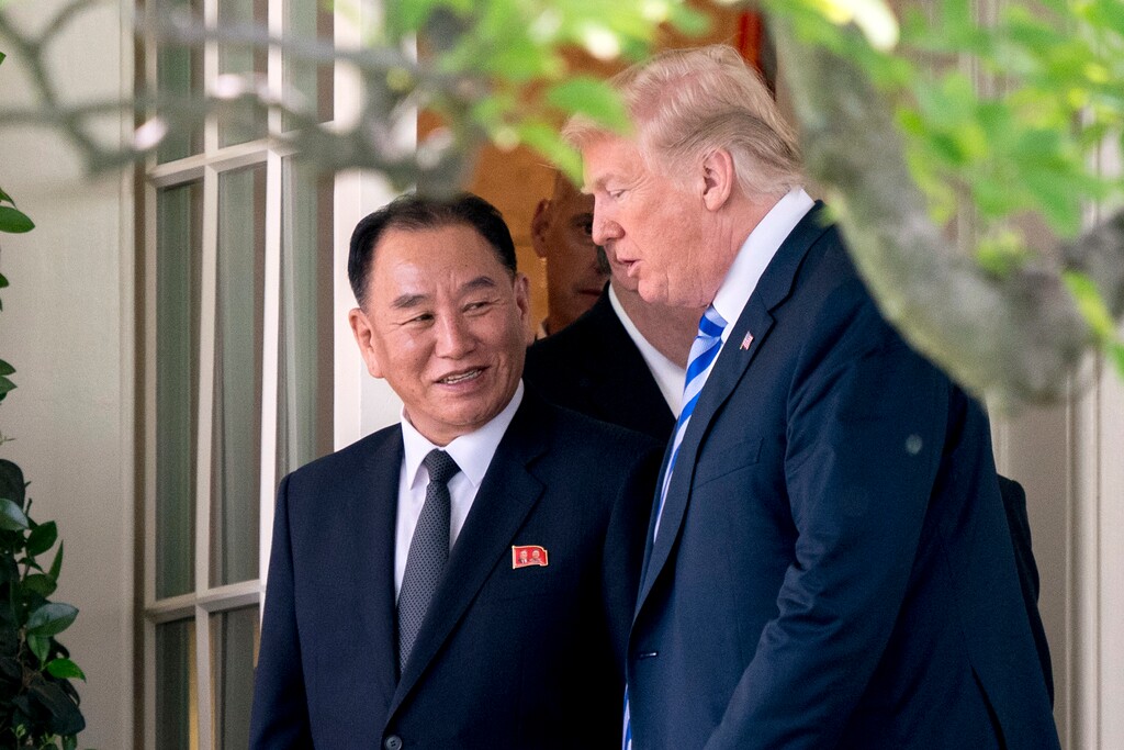 President Donald Trump talks with Kim Yong Chol, former North Korean military intelligence chief and one of leader Kim Jong Un's closest aides, as they walk from their meeting in the Oval Office of the White House in Washington, Friday, June 1, 2018. (AP Photo/Andrew Harnik)