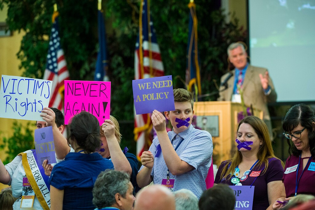 Chris Detrick  |  Tribune file photo
Protesters demonstrate as then-Chairman Peter Corroon speaks during the Utah Democratic Party Convention on June 17. They were upset that the party did not more vigorously pursue sexual harassment allegations against a candidate. The party plans to hold a second convention to finish work on its platform.