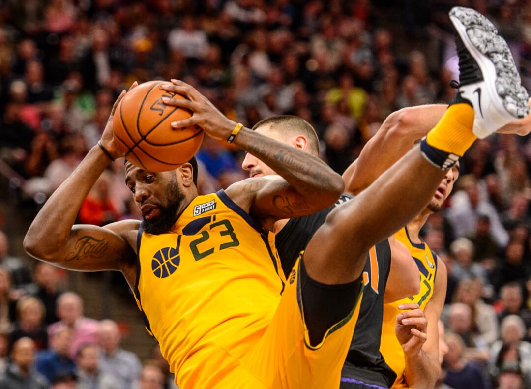 (Trent Nelson | The Salt Lake Tribune)  Utah Jazz forward Royce O'Neale (23) falls to the floor with a rebound as the Utah Jazz host the Phoenix Suns, NBA basketball in Salt Lake City, Wednesday Feb. 14, 2018.