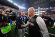 (Julio Cortez | AP) BYU head coach Kalani Sitake, left, and Texas Tech head coach Joey McGuire, right, greet each other after the Big 12 Conference championship game.