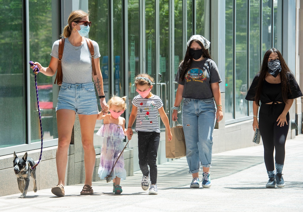 (Rick Egan  |  Tribune file photo)      Mary Kendall Hegland walks with her daughters, Brecken and Auburn, their dog Boone, and Layli and Nisha Parisi, in downtown Salt Lake City on Friday, June 26, 2020.